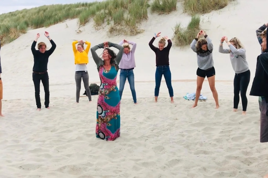 Group yoga session on the beach